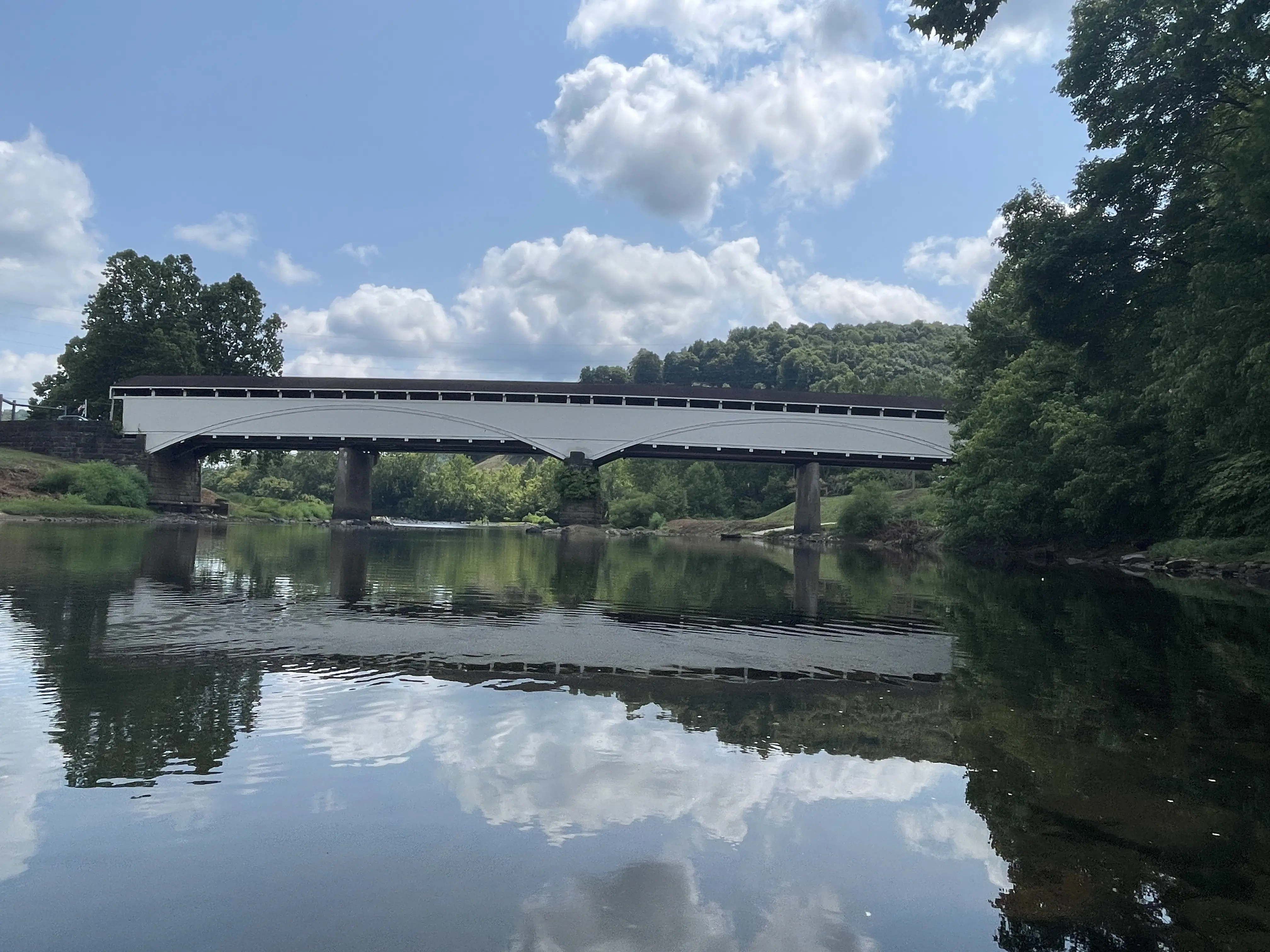 A view of the Philippi Covered Bridge from the water